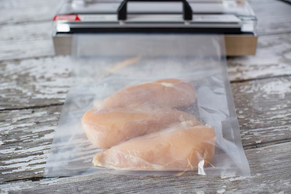 3 large chicken breasts vacuum sealed in an Avid Armor gallon size vacuum seal bag