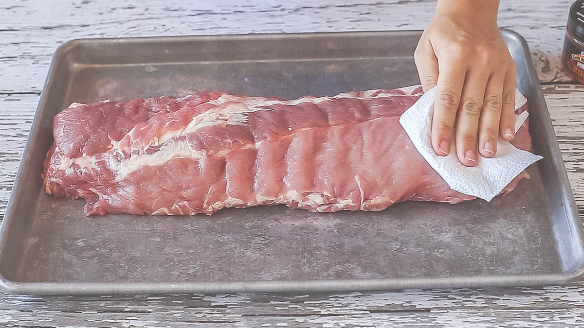 Preparing pork ribs for run and vacuum sealing