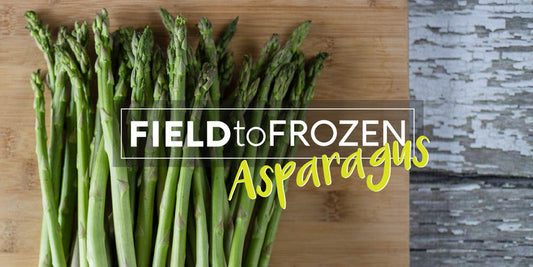 Fresh asparagus spears on a wooden board with 'Field to Frozen Asparagus' text promoting vacuum sealing and freezing tips.
