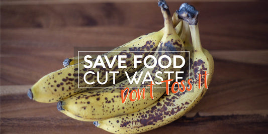 Overripe bananas on wood with message 'Save Food, Cut Waste – Don’t Toss It' to promote reducing food waste at home