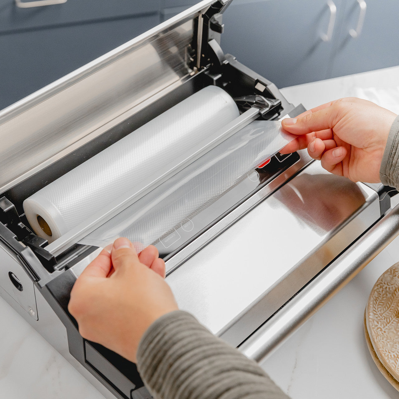 Avid Armor A420 vac machine features roll storage compartment to hold rolls up to 25' long.