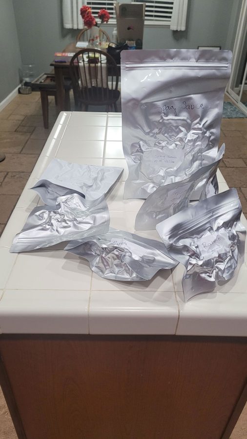 Sealed Mylar pouches from a freeze dryer run on a kitchen counter, photo from Avid Armor customer Sam H.