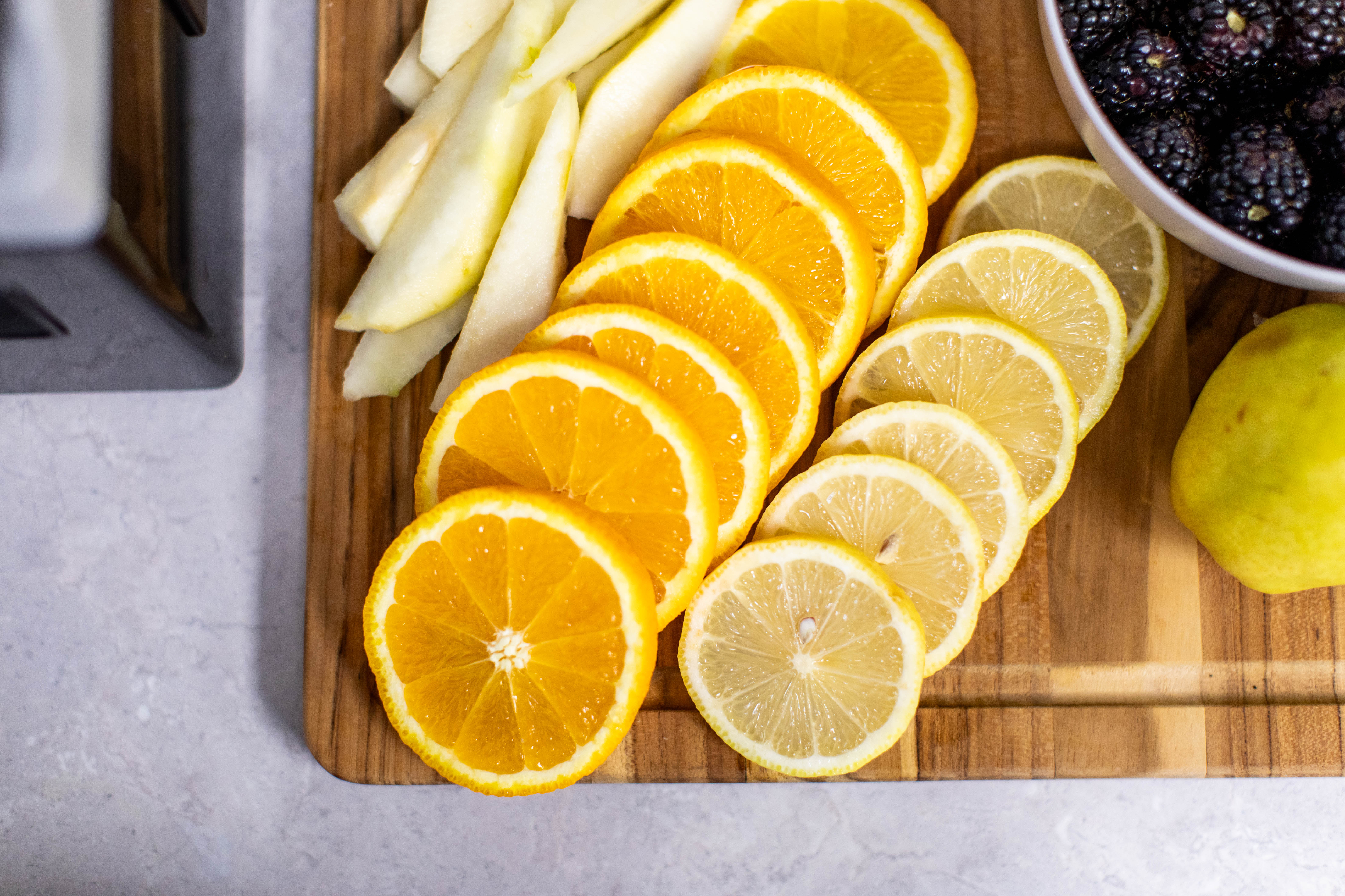 Zesty Fruit Medley: Sliced Pears, Oranges, and Lemons