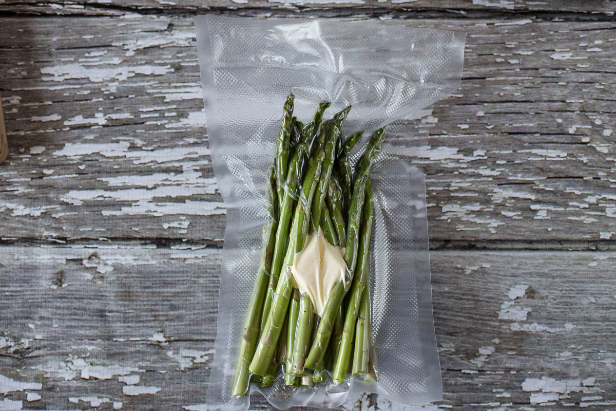 Asparagus and butter in a vacuum sealer bag