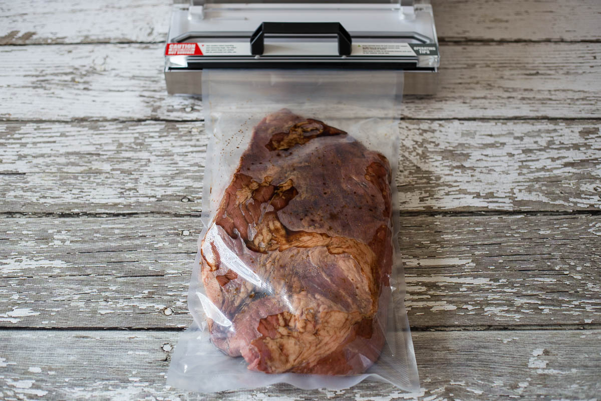 Vacuum seal beef brisket in food vacuum bag roll
