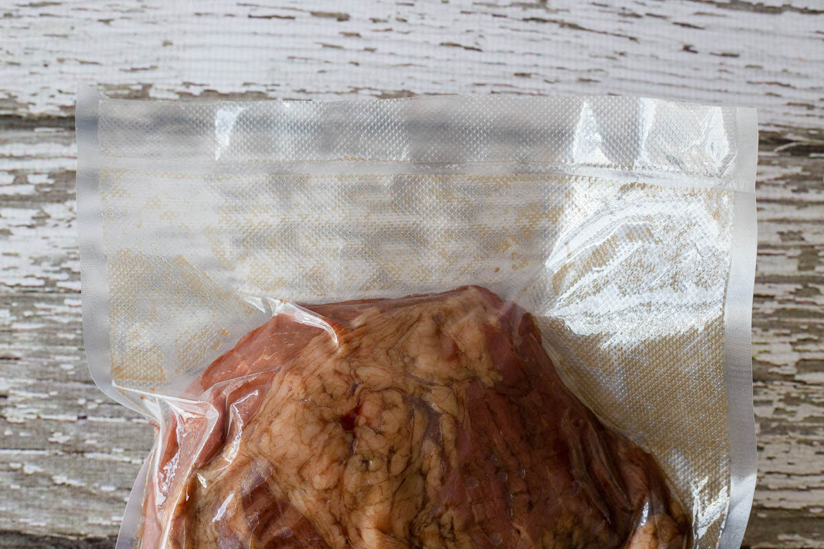 Marinade and beef brisket in an 11 inch food vacuum seal bag