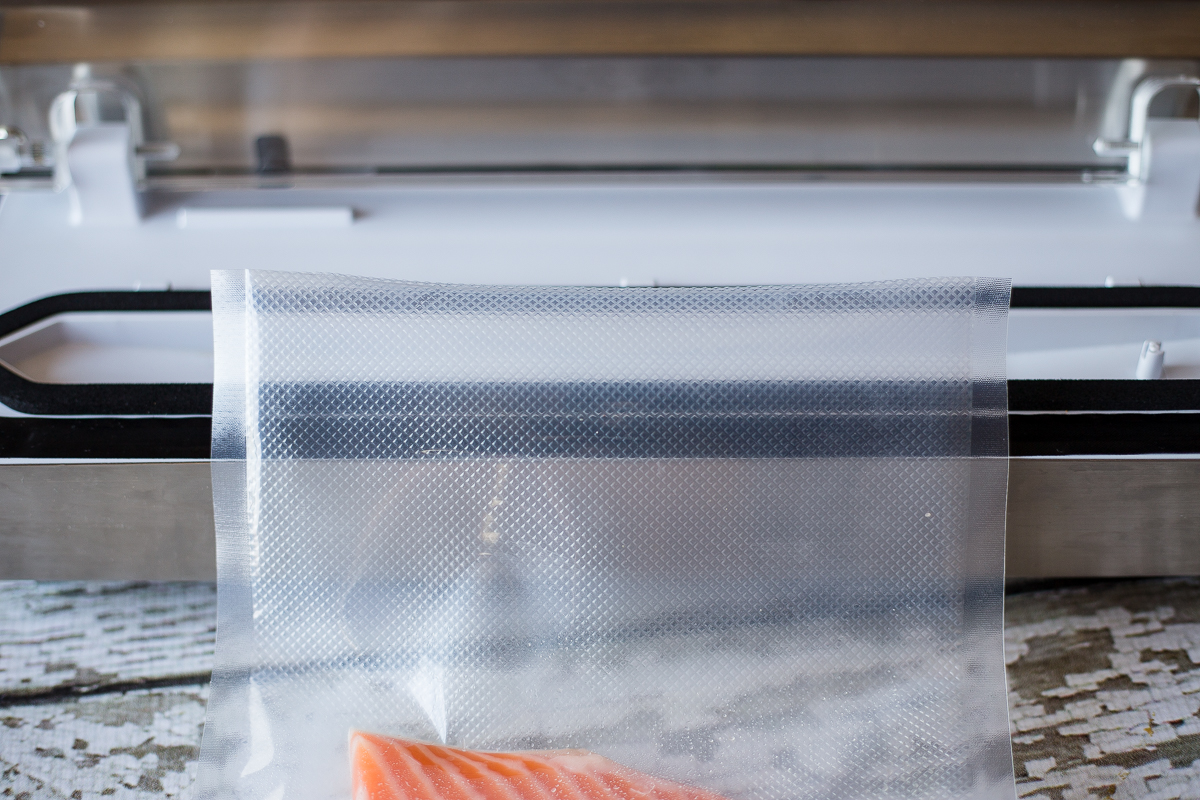 Lay the vacuum seal bag flat across the seal bar without any wrinkles