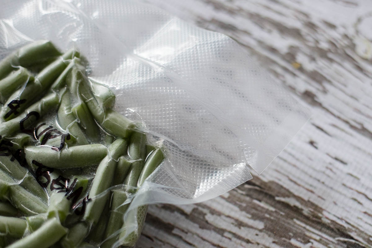 Frozen green beans in vacuum sealed steam bag