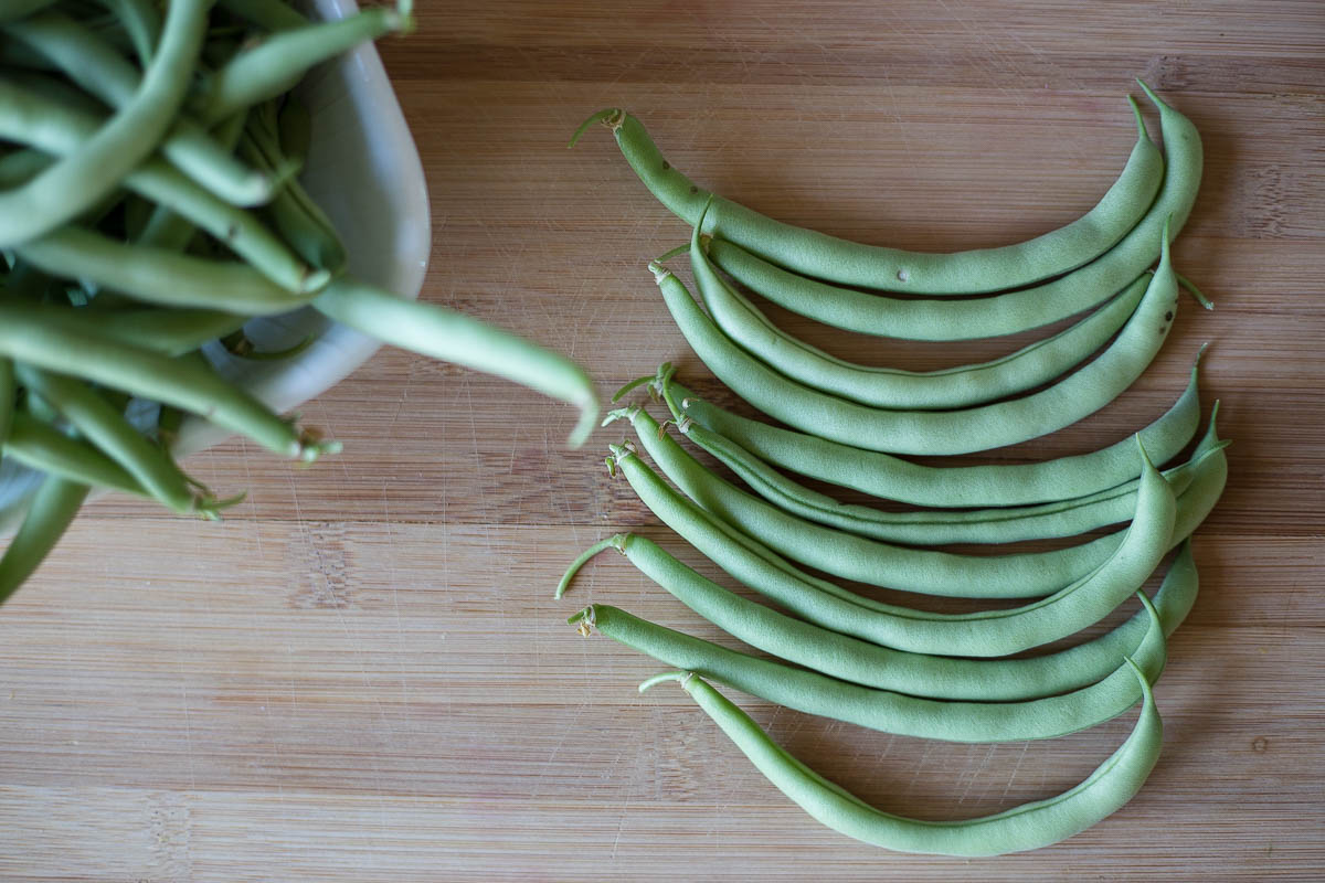 Prepping green beans to be vacuum sealed for long term freezer storage