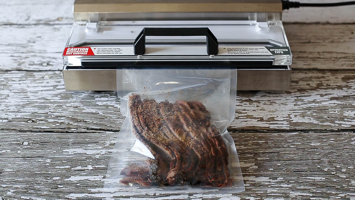 Vacuum seal leftover beef brisket in quart size food vacuum bag